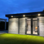 Light Grey Composite Garden Building At Dusk