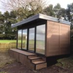 Walnut Garden Room Built Into Slope With Matching Steps