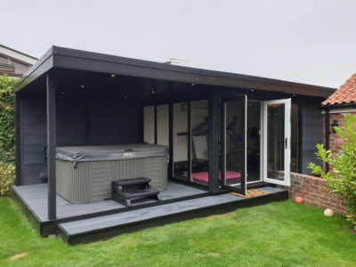 Garden-room-with-hot-tub-canopy-and-inside-gym
