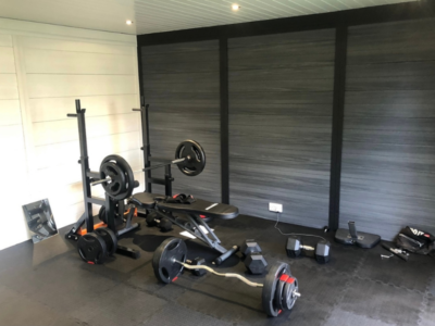 Dark-grey-garden-room-with-gym