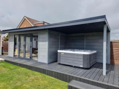 Light Grey Composite Garden Building With Hot Tub Enclosure Decking Area