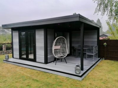 Light Grey Garden Building With Seating Decking Area